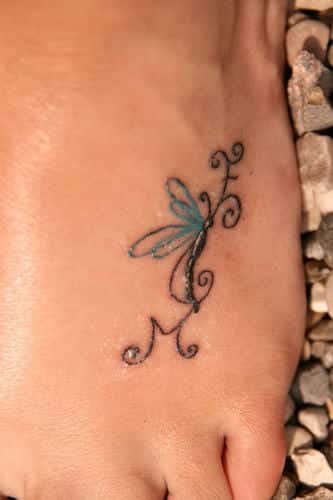 intimbereich blumen Tattoo